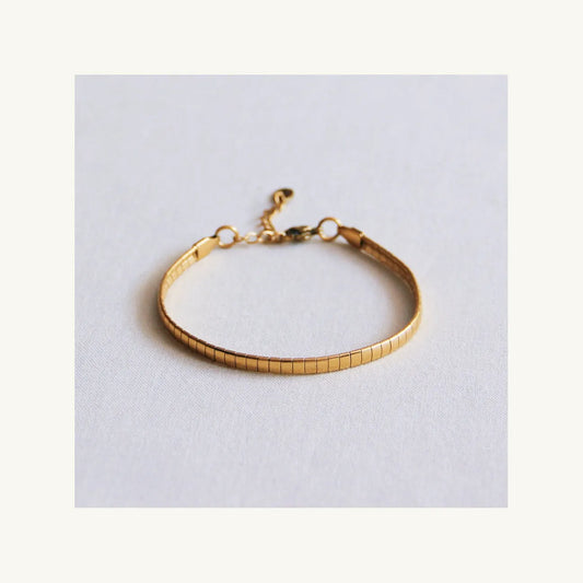 Stalen platte armband gestreept - goud